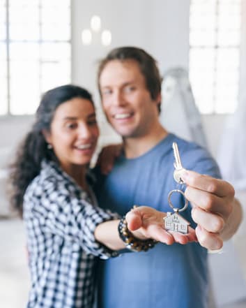 Couplr holding new house keys